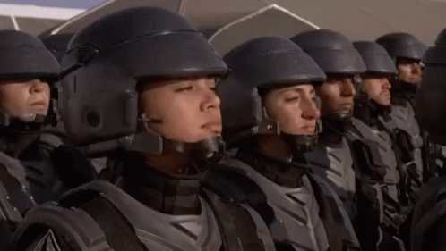 GIF from Starship Troopers showing a female Trooper saying, "I'm doing my part!"